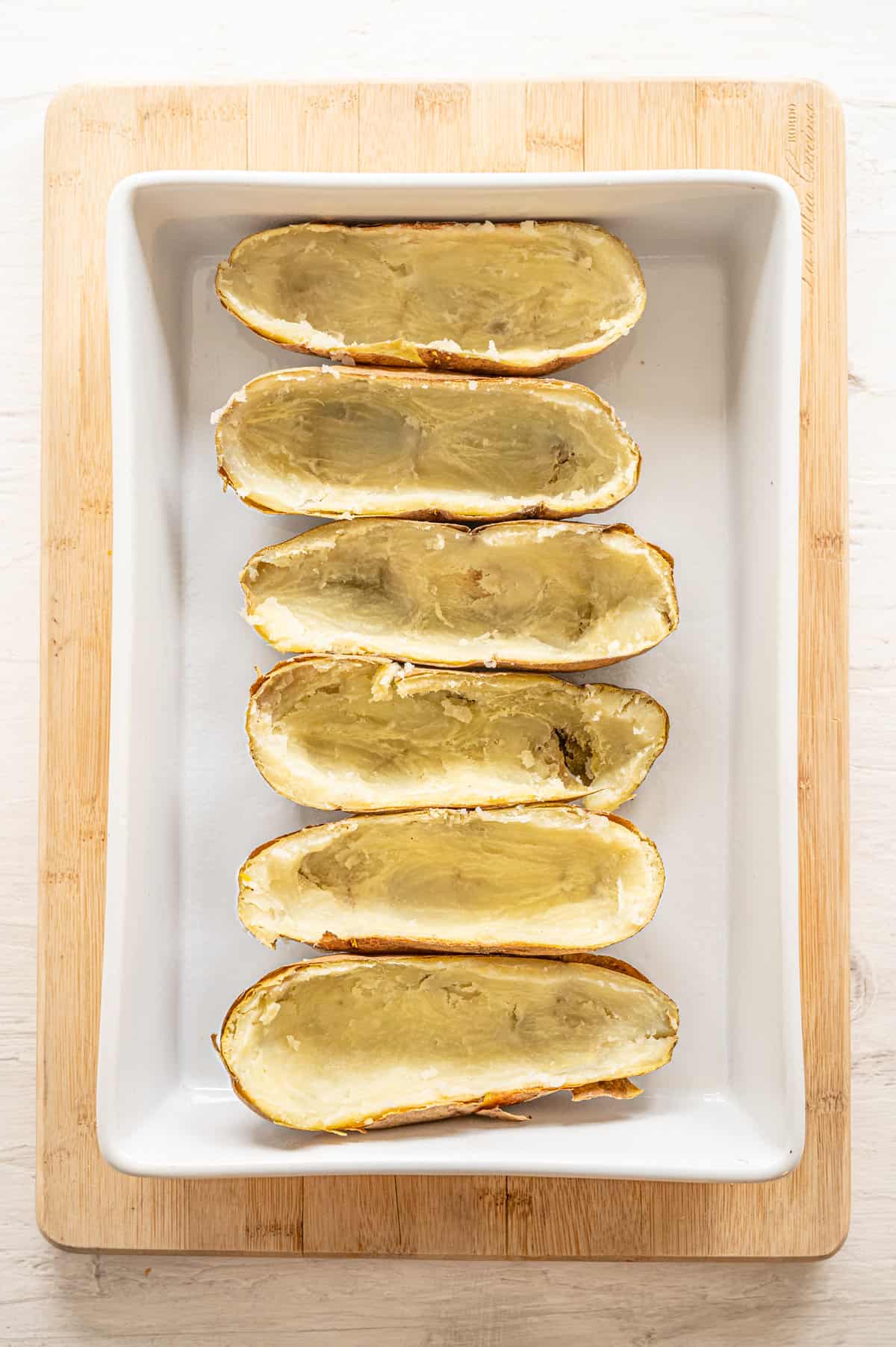 baked potatoes with their insides scooped out