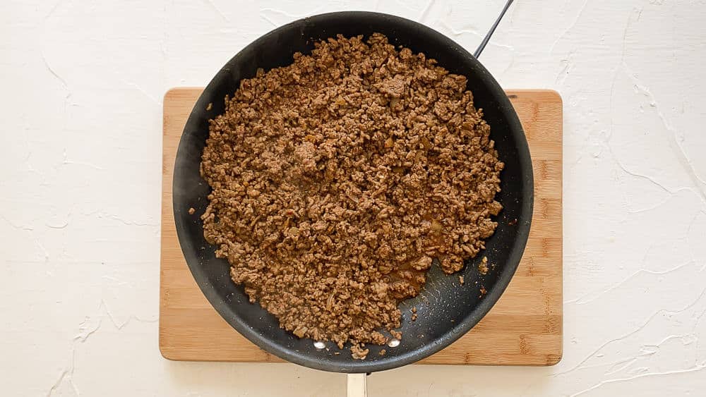seasoned ground meat for taco meat recipe in a skillet.