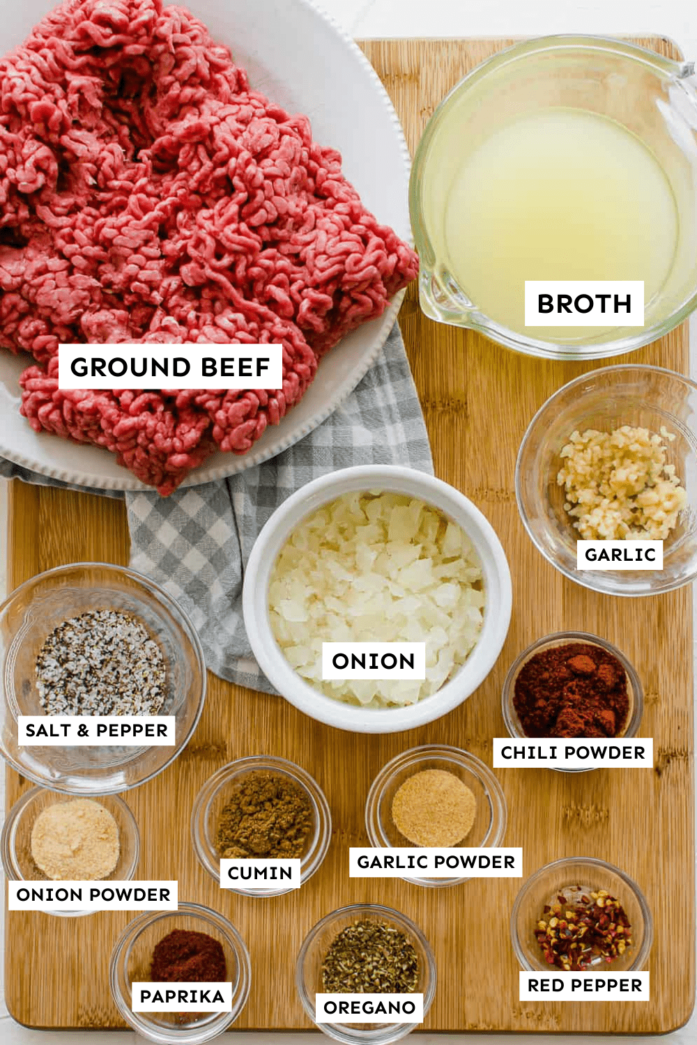 ingredients for taco meat recipe in individual bowls on a counter.