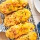 Twice baked potatoes on a serving platter.