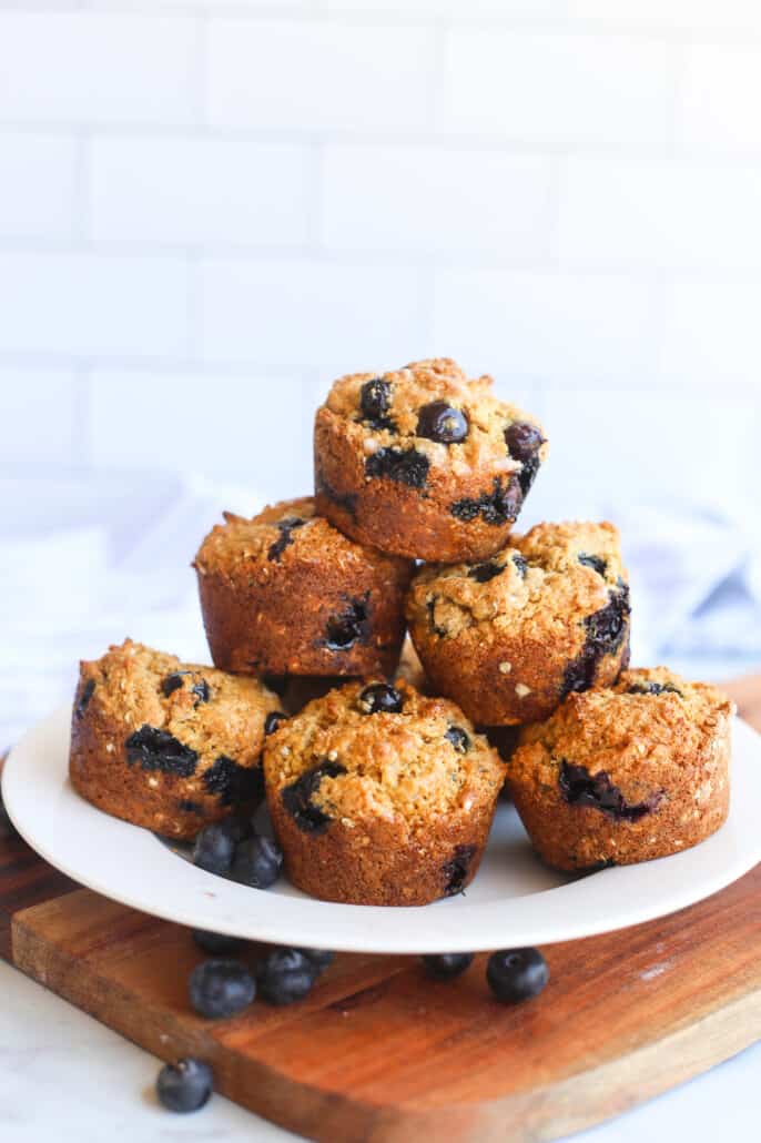 Blueberry Oatmeal Muffins stacked on a white plate