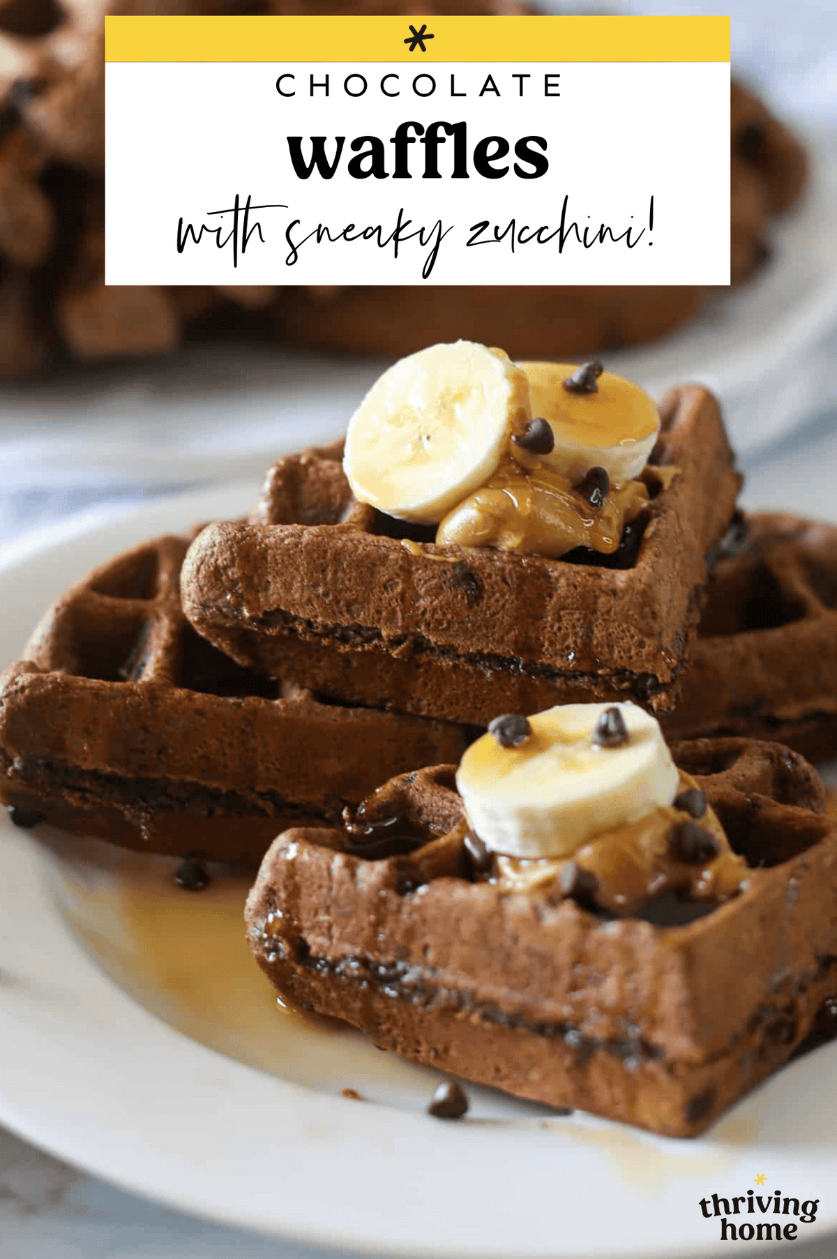 Chocolate zucchini waffles with sliced bananas and maple syrup.