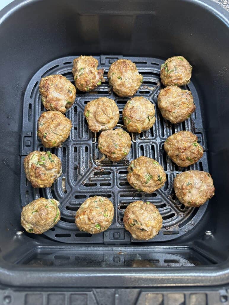 air fryer meatballs inside the air fryer basket