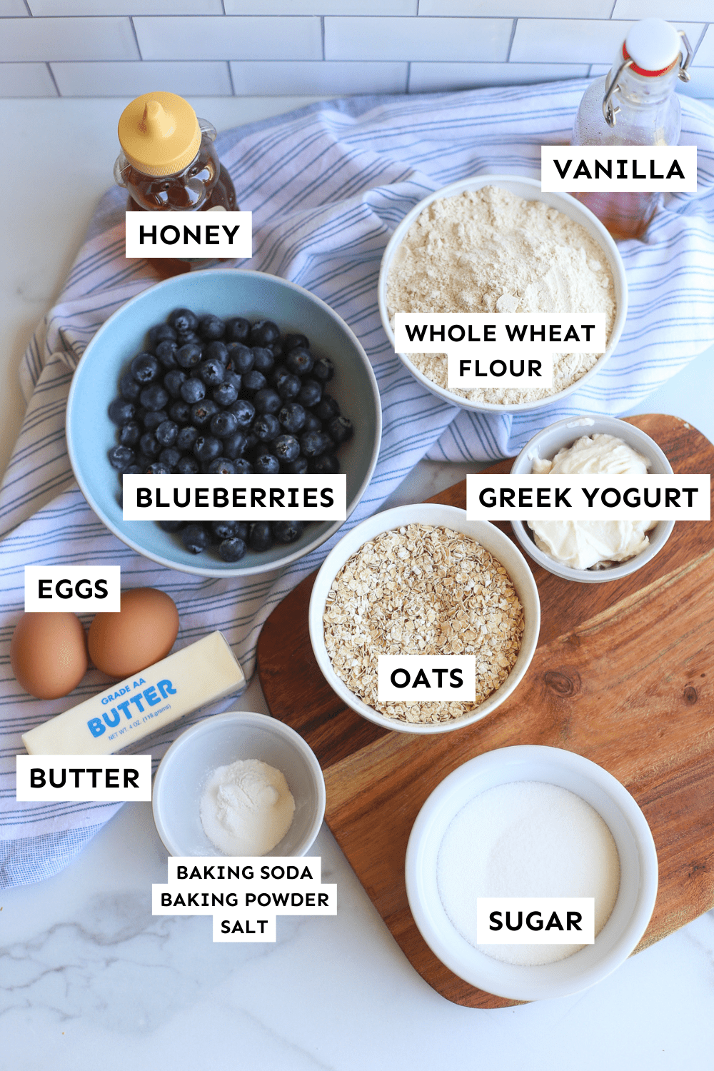 Blueberry oatmeal muffin ingredients measured and labeled.