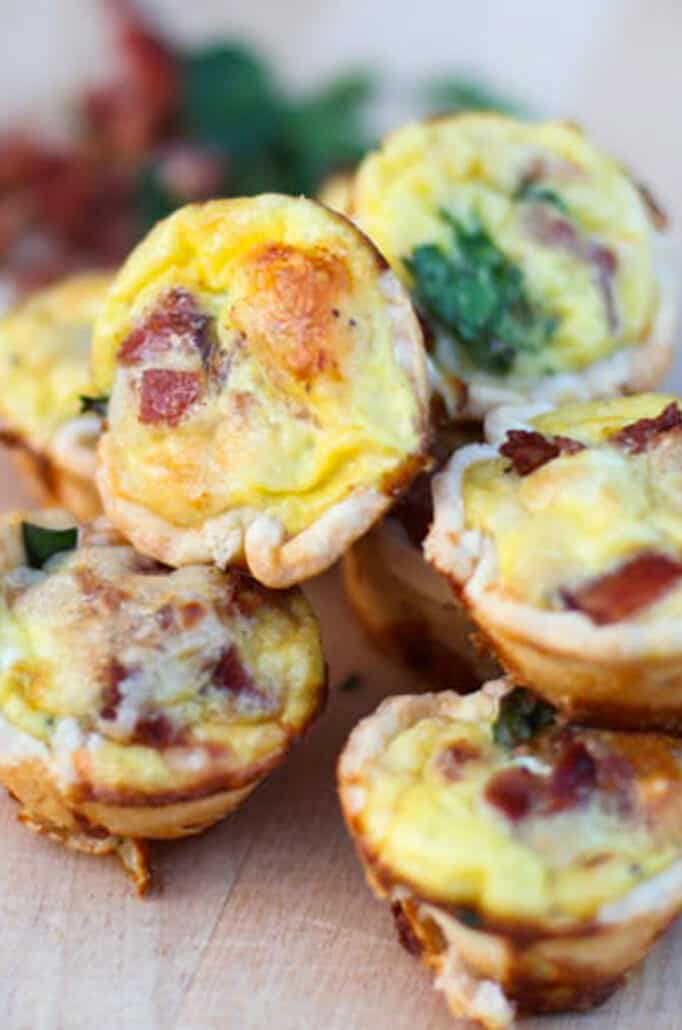 Mini quiches piled on top of each other.
