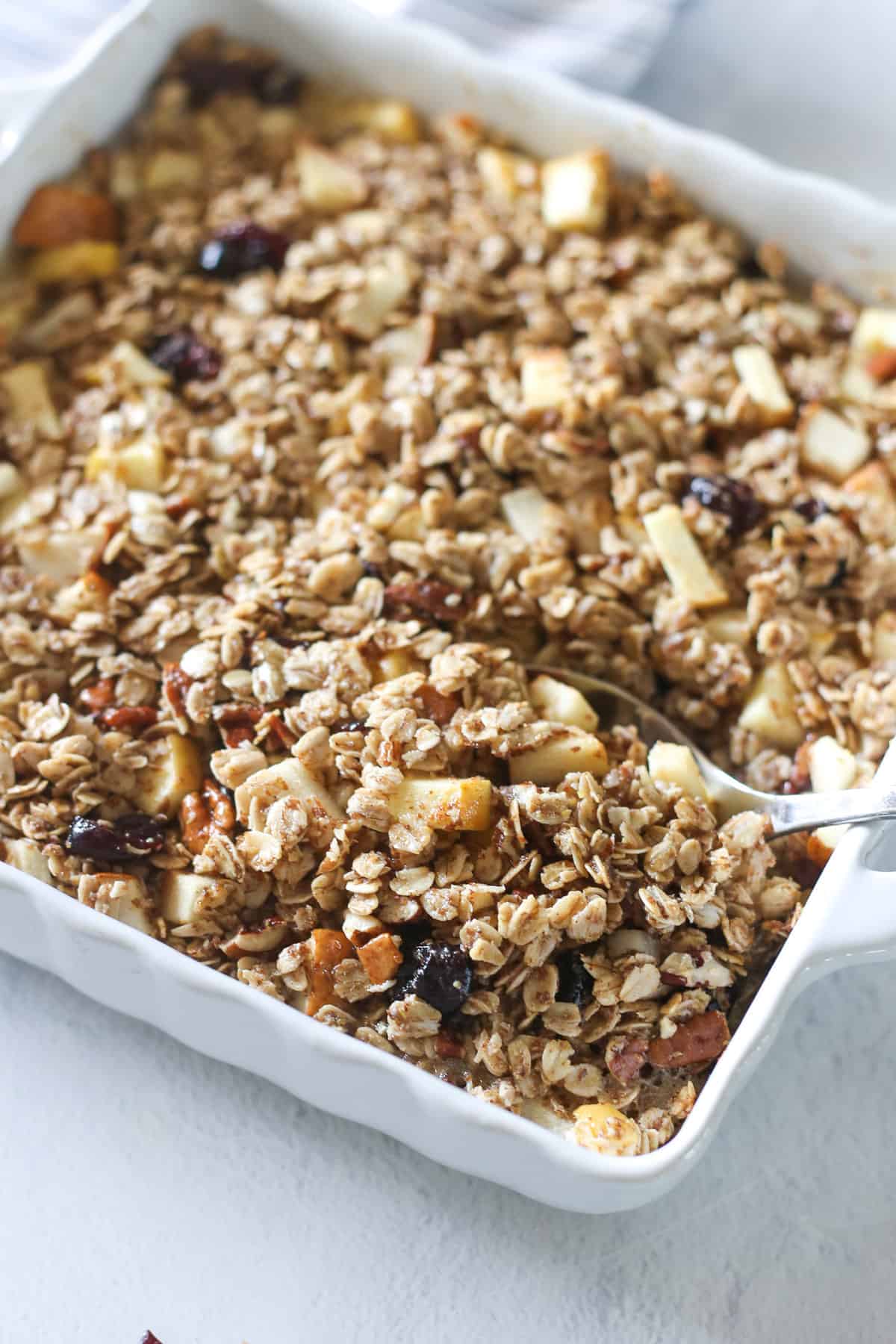 Mixed fruit baked oatmeal in a white casserole dish.