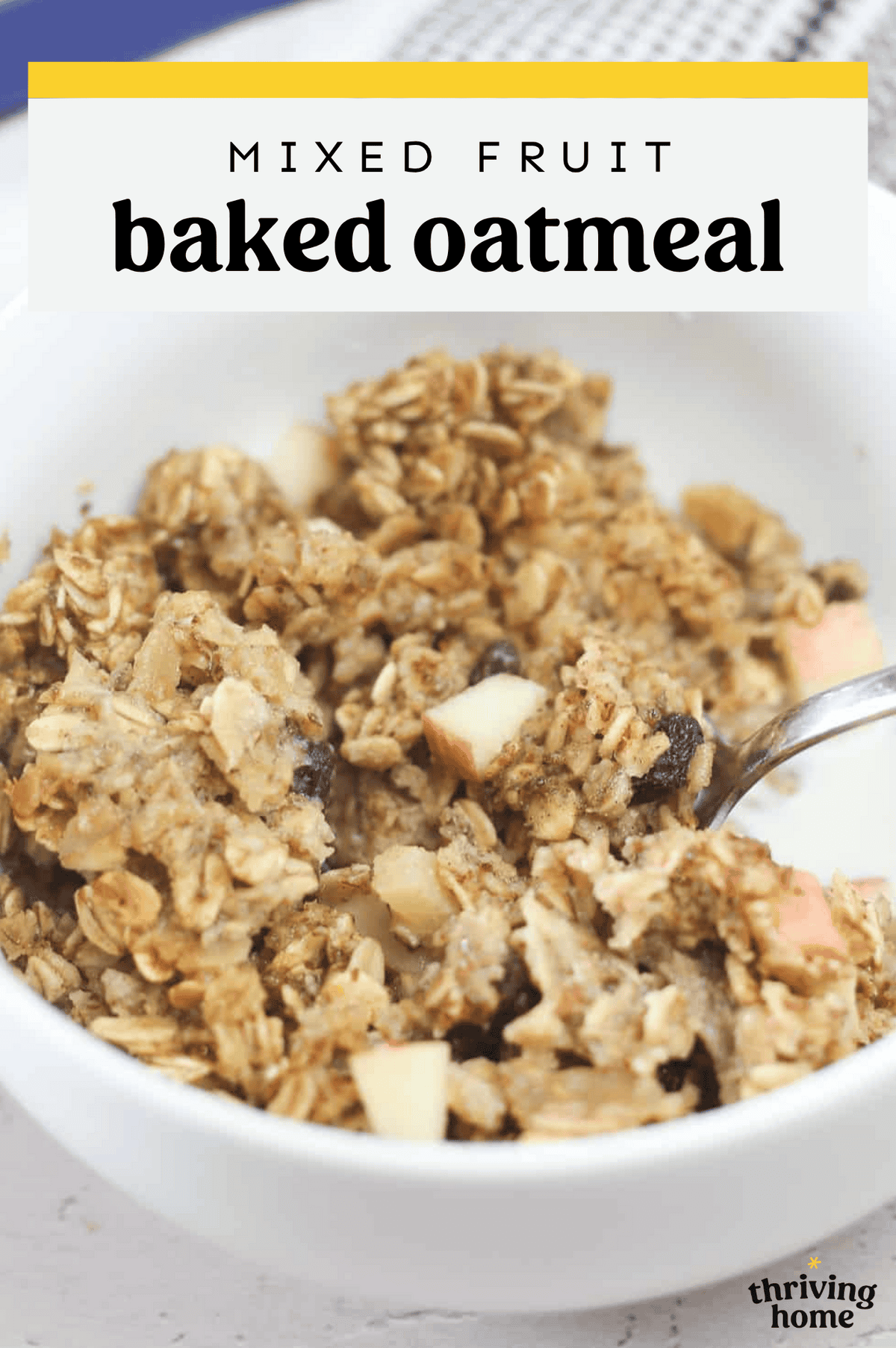 Mixed fruit baked oatmeal in a bowl served with milk.