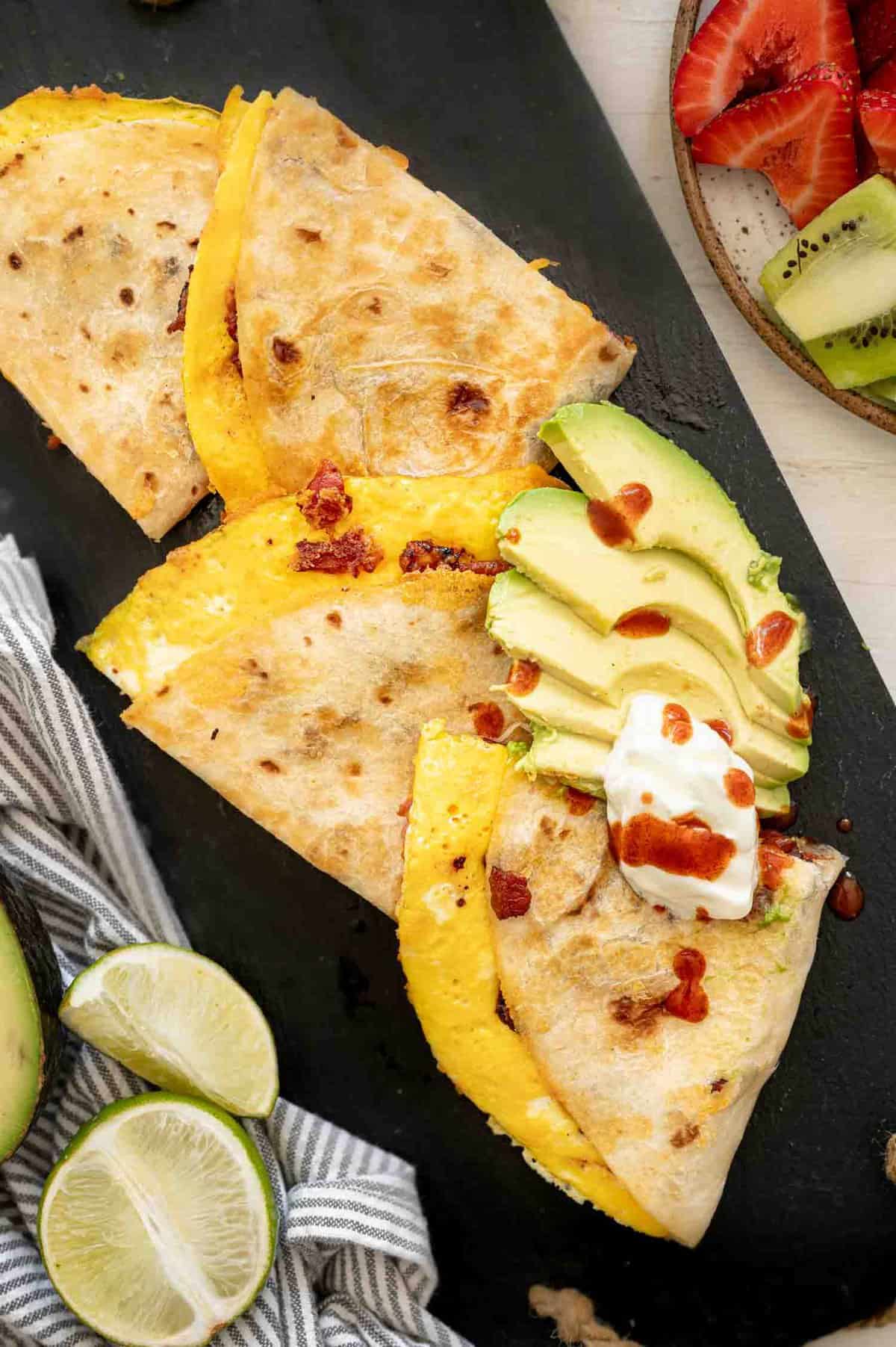 Cut up Breakfast Quesadilla with sliced avocado