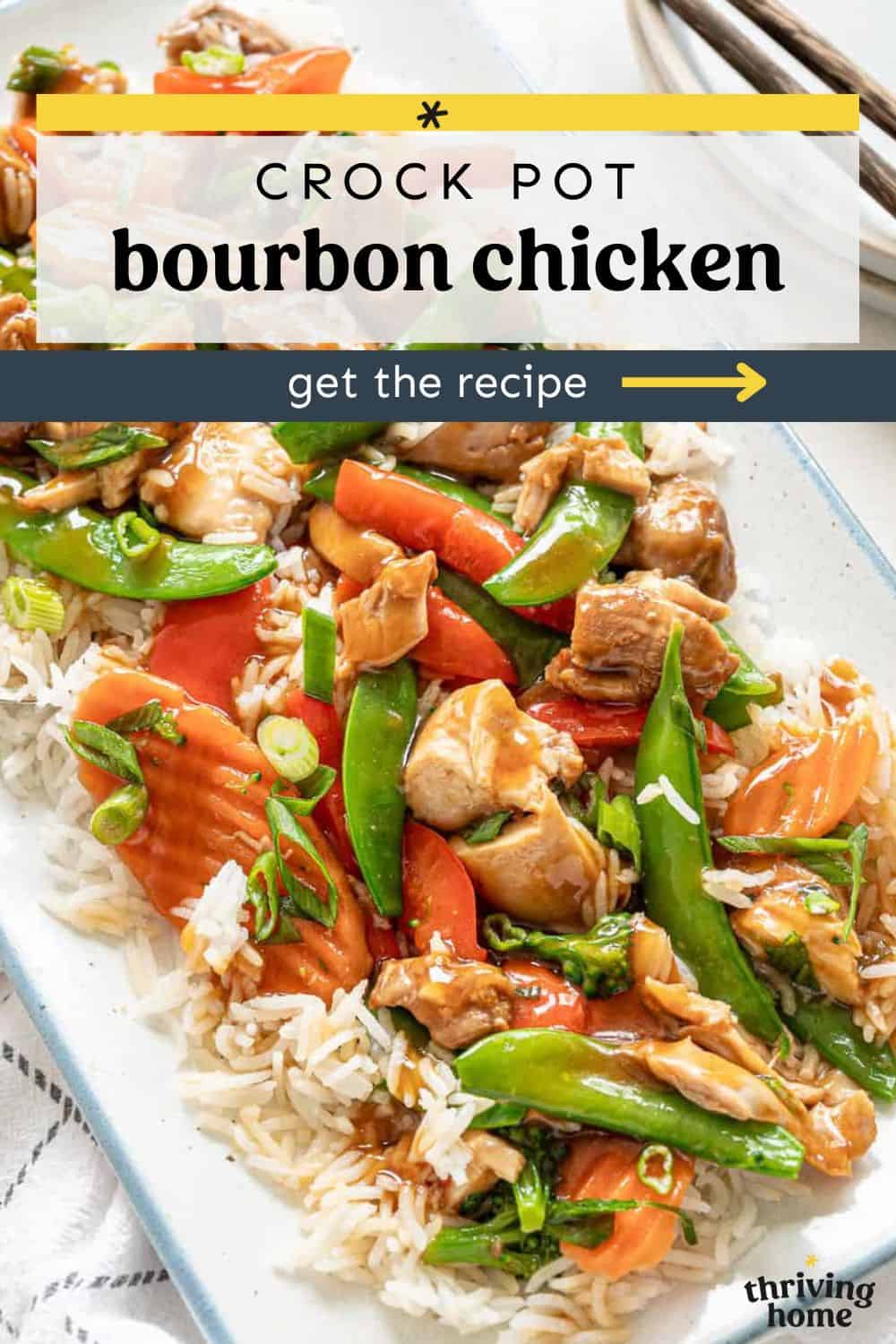 Chicken, stir fry vegetables, and rice on a serving platter with bourbon sauce over the top.