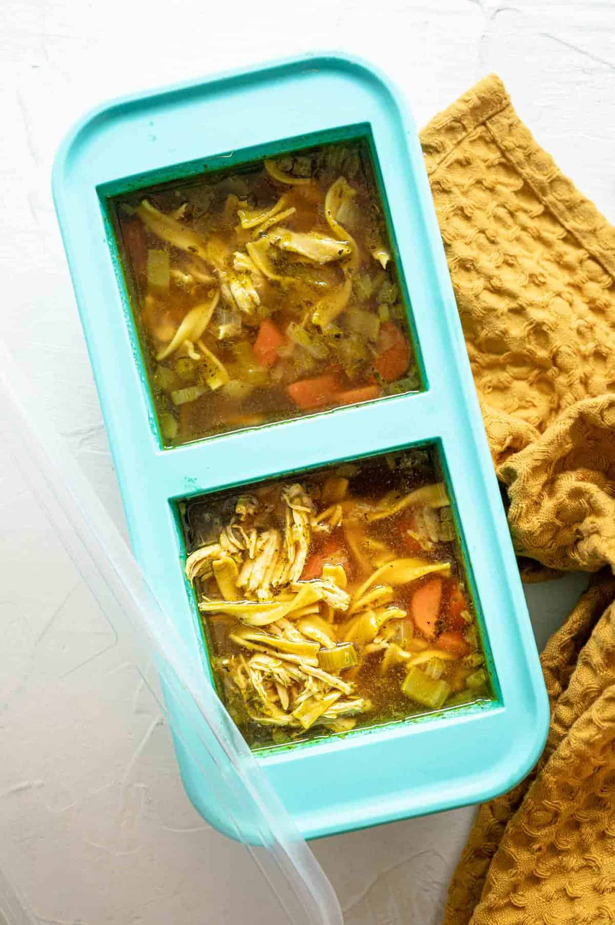 Homemade chicken noodle soup in Souper Cubes to freeze individual portions.