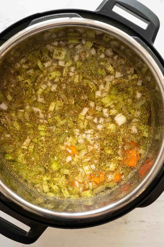Ingredients dumped into Instant Pot for Chicken Noodle Soup