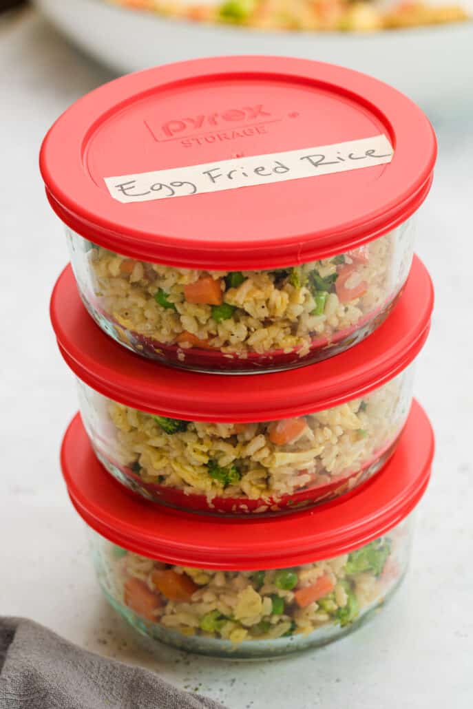 Easy Chicken Fried Rice in Pyrex containers labeled for freezer