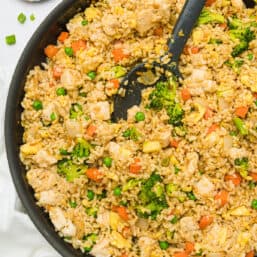 Chicken fried rice in a skillet.