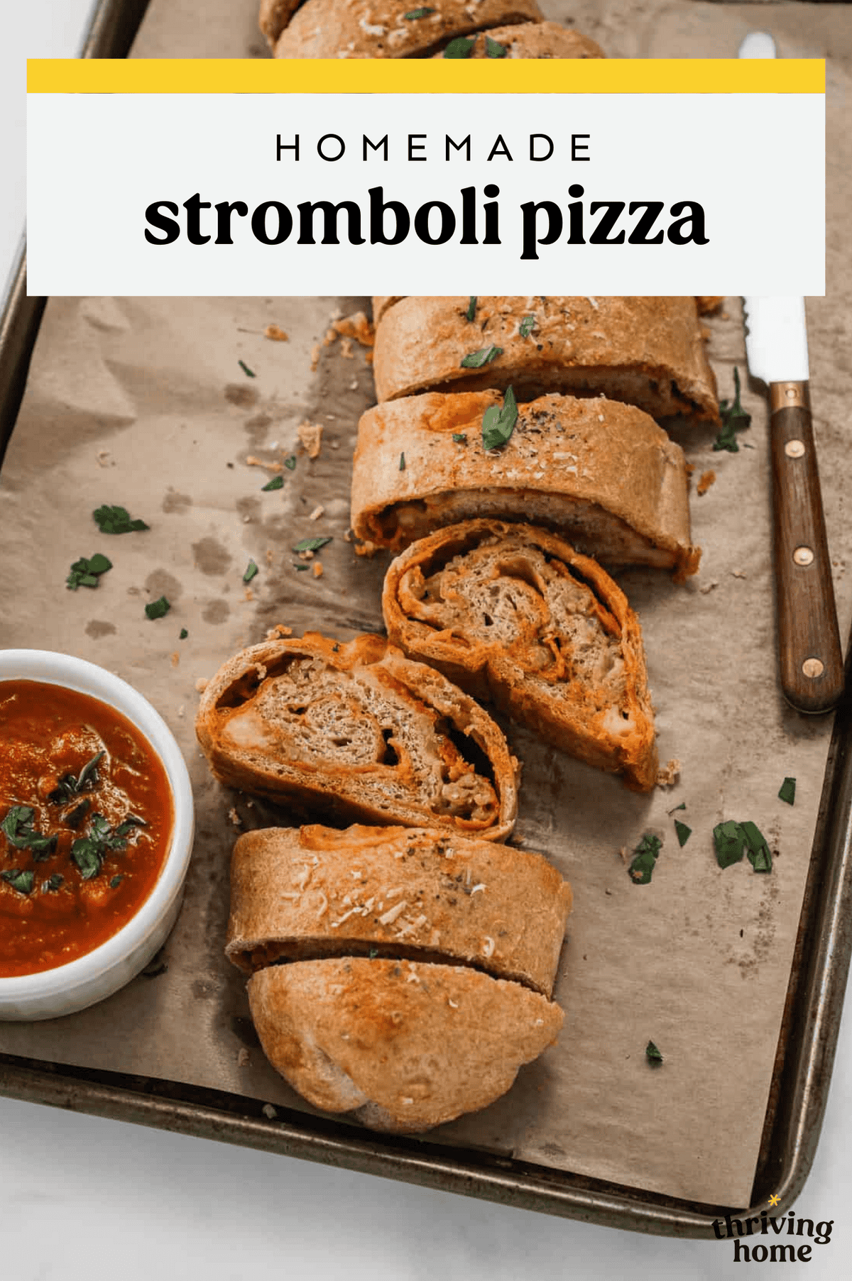 Stromboli pizza slices on a parchment-lined baking sheet.