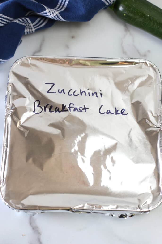 zucchini breakfast cake covered in foil and ready to freeze