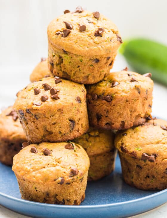 Chocolate Chip Zucchini Muffins stacked on a plate