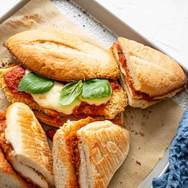 Close up of Chicken Parmesan Sandwiches on Baking sheet