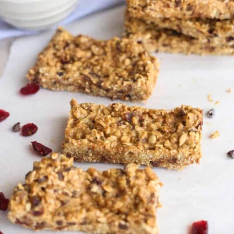 peanut butter protein bars laid out on parchment paper