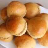 Bread machine hamburger buns on a plate to serve.