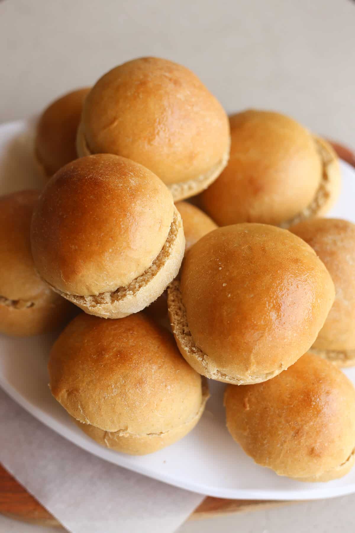 Bread machine hamburger buns on a white platter.