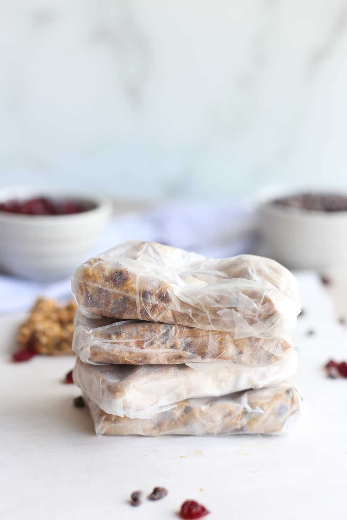 Homemade peanut butter protein bars wrapped individually in plastic baggies for storing.
