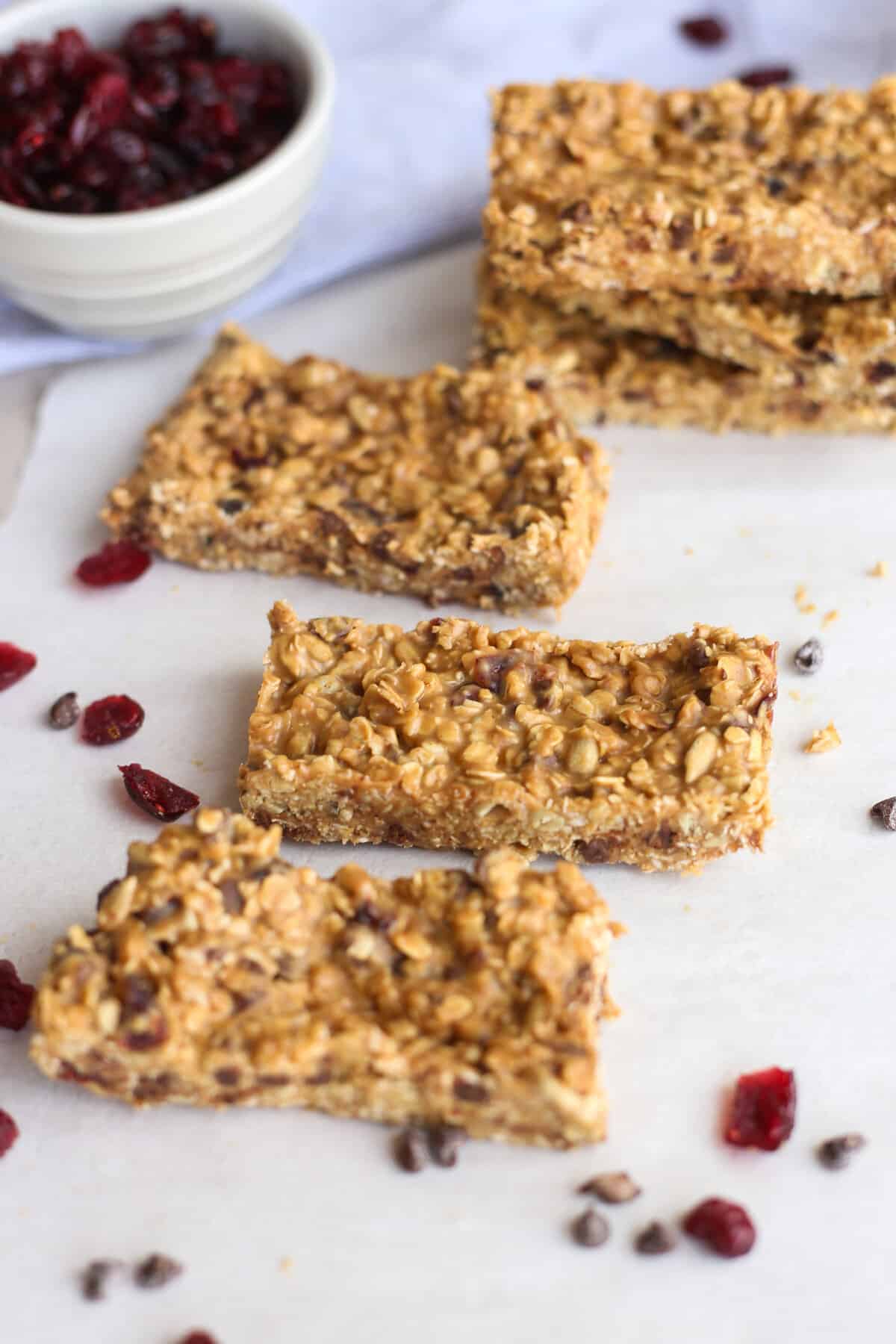 Homemade peanut butter protein bars laid out on parchment paper.
