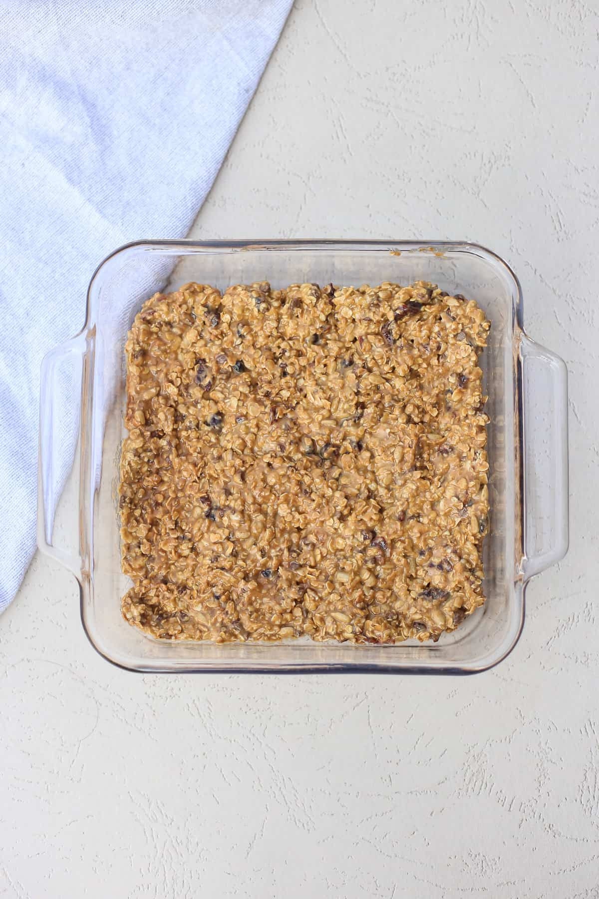 peanut butter protein bar mix in an 8x8 glass dish
