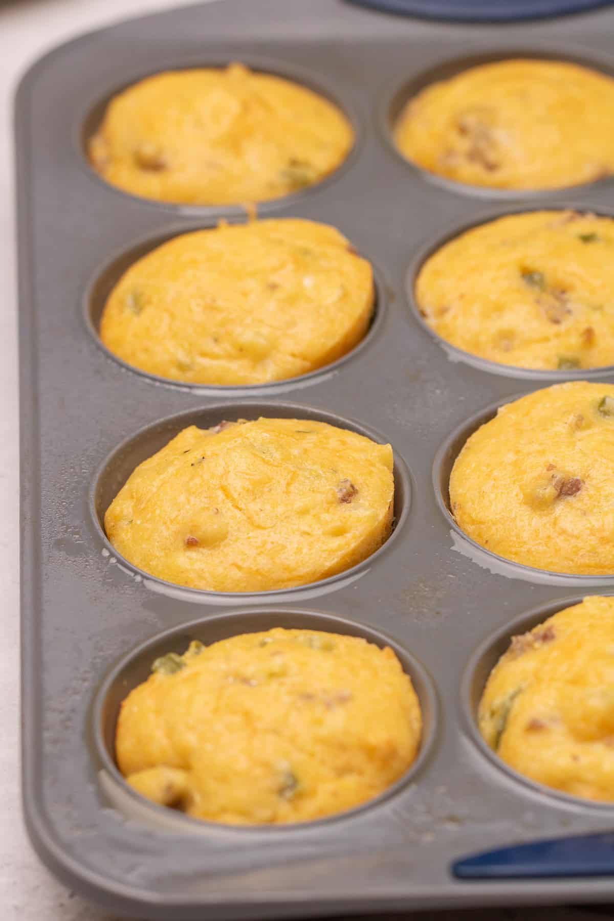 Closeup of Savory Breakfast Muffins in the muffin tin after coming out of the oven.