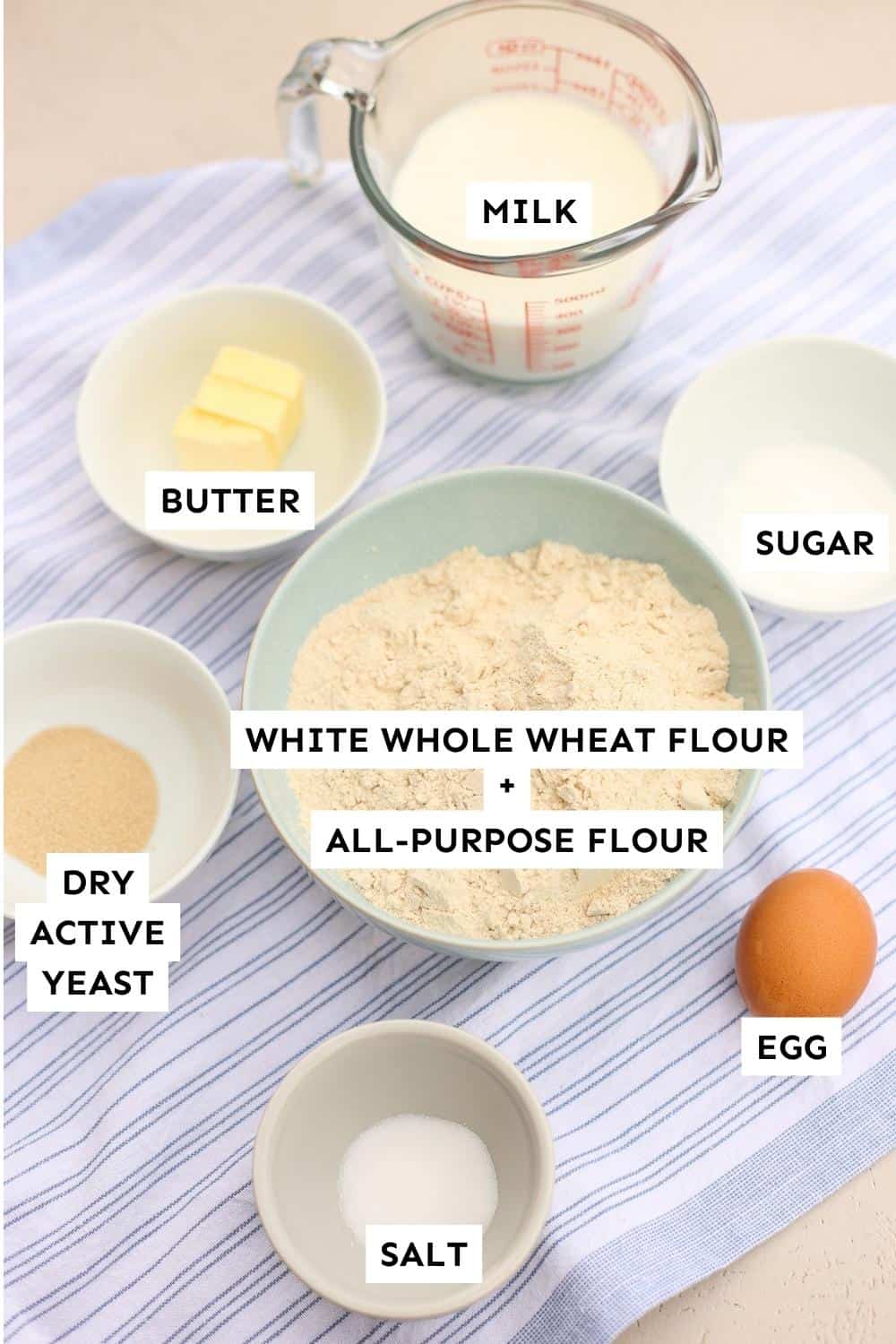 Whole Wheat Hamburger Bun ingredients laid out and labeled.