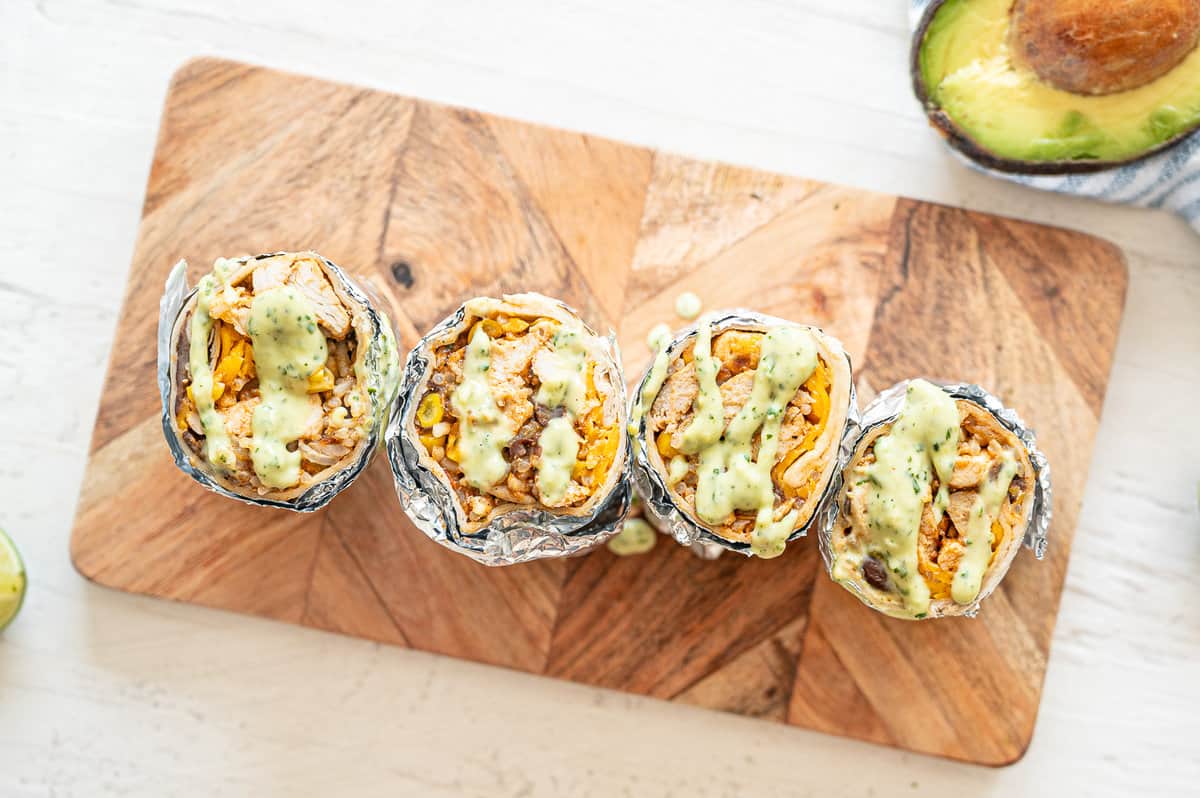 Chicken Burritos, cut in half, drizzled with Lime Aioli.