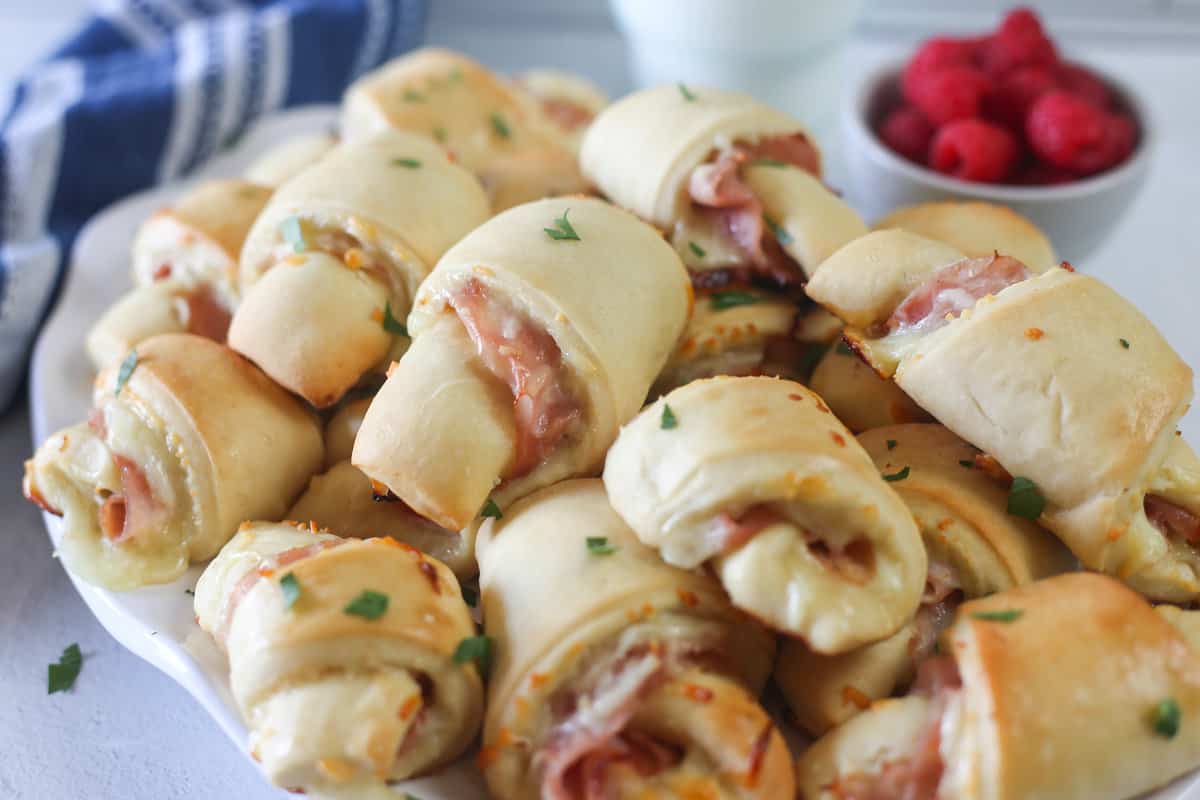 A pile of ham and cheese croissants.