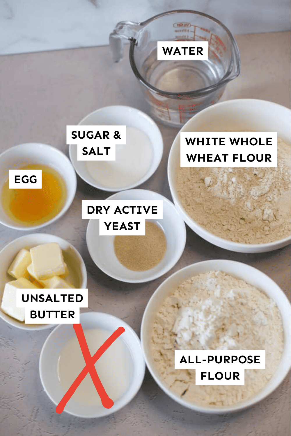 Bread Machine Whole Wheat Dinner Rolls Ingredients measured out in bowls and labeled.