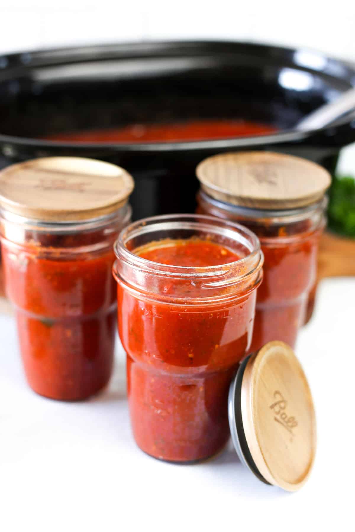 Homemade marinara sauce in mason jars.