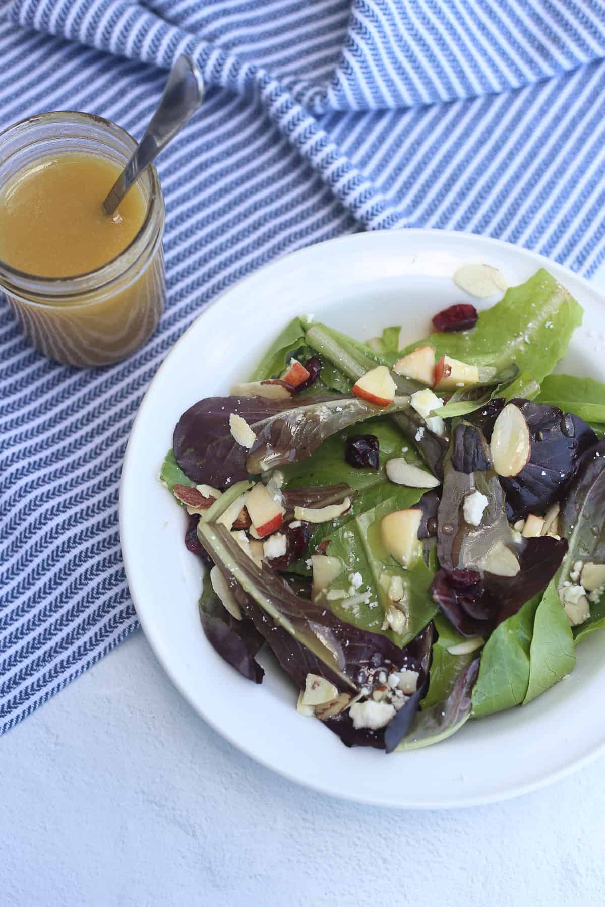 Salad with apples, almonds, feta, and honey dijon salad dressing.