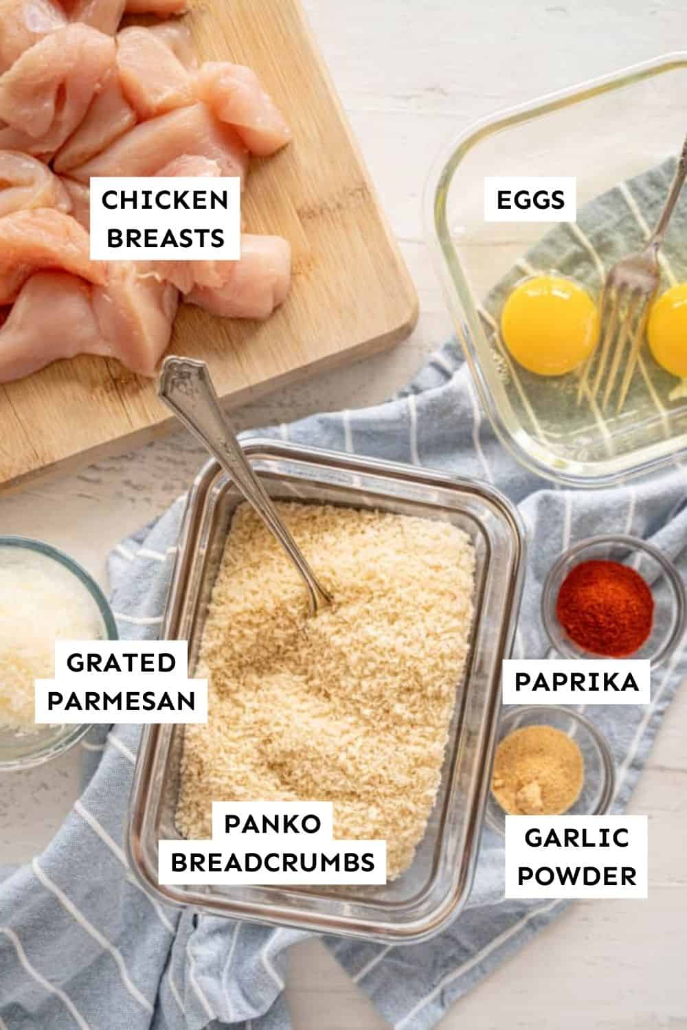 Ingredients for chicken nuggets displayed on a kitchen counter.