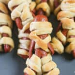 Mummy hot dogs on a plate.