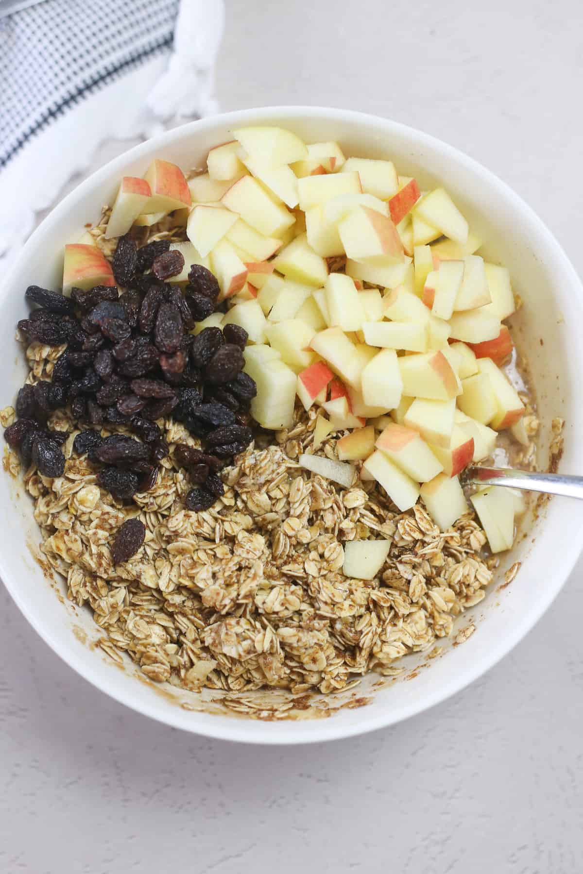 Ingredients for apple cinnamon baked oatmeal in a bowl. 