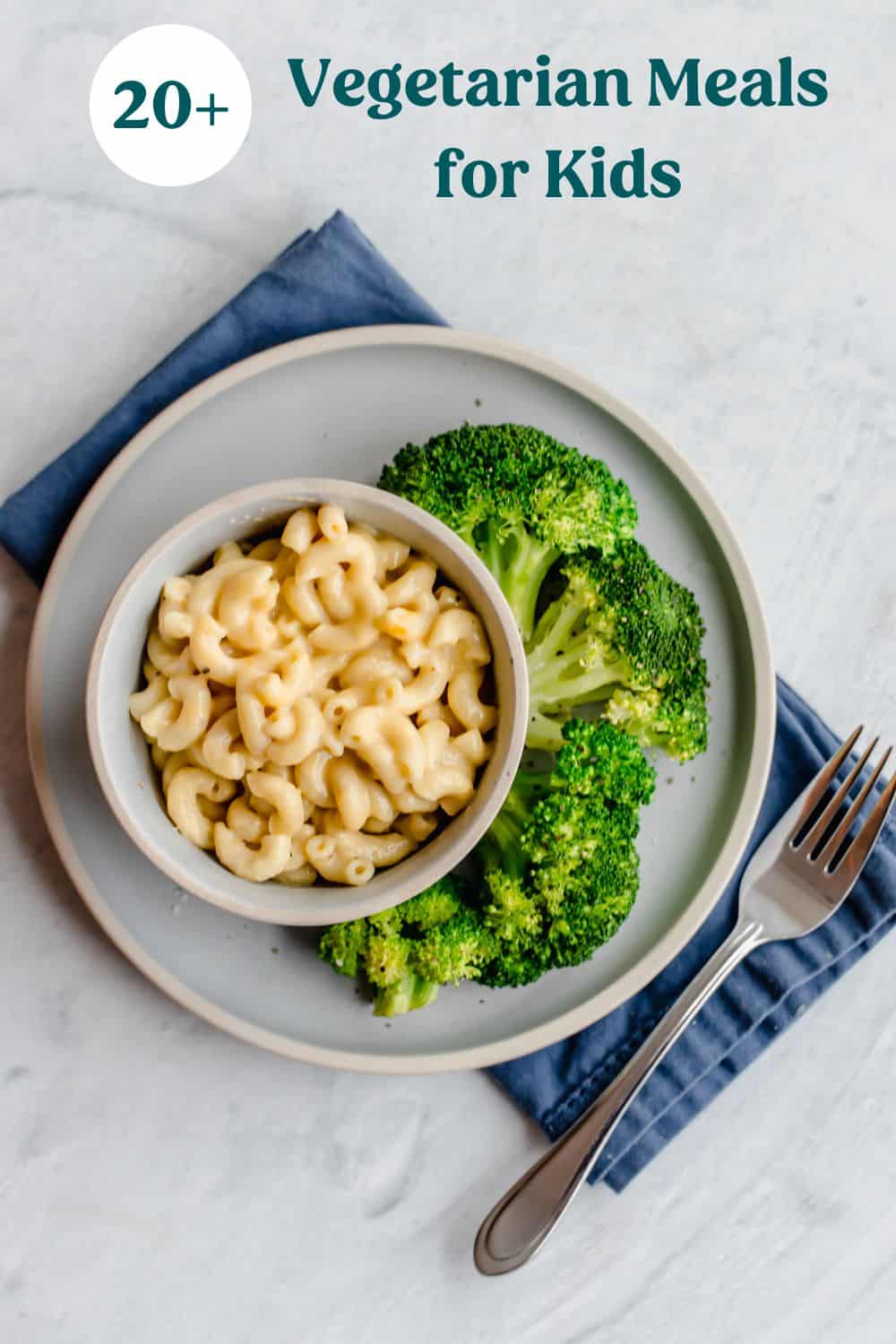 A plate with macaroni and cheese and steamed broccoli on it.