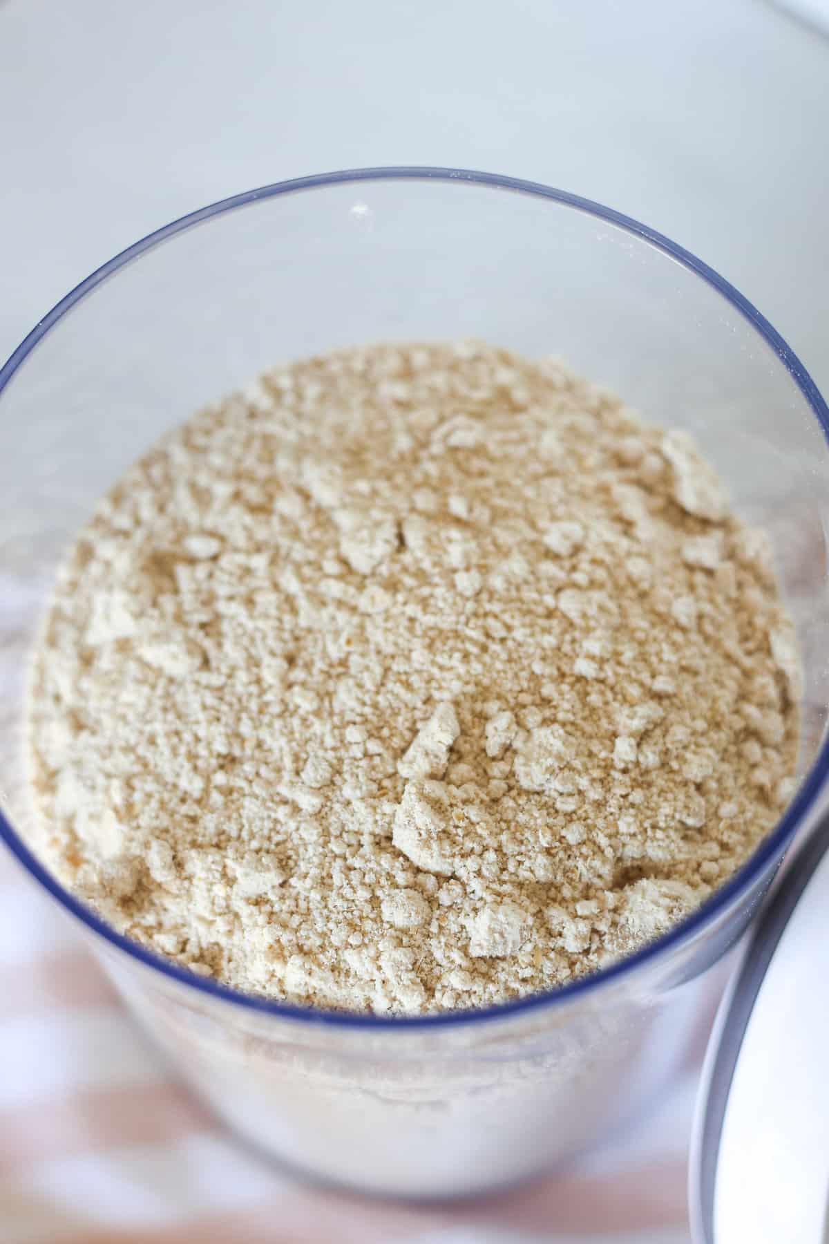 Dry oatmeal pancake mix in a large container. 