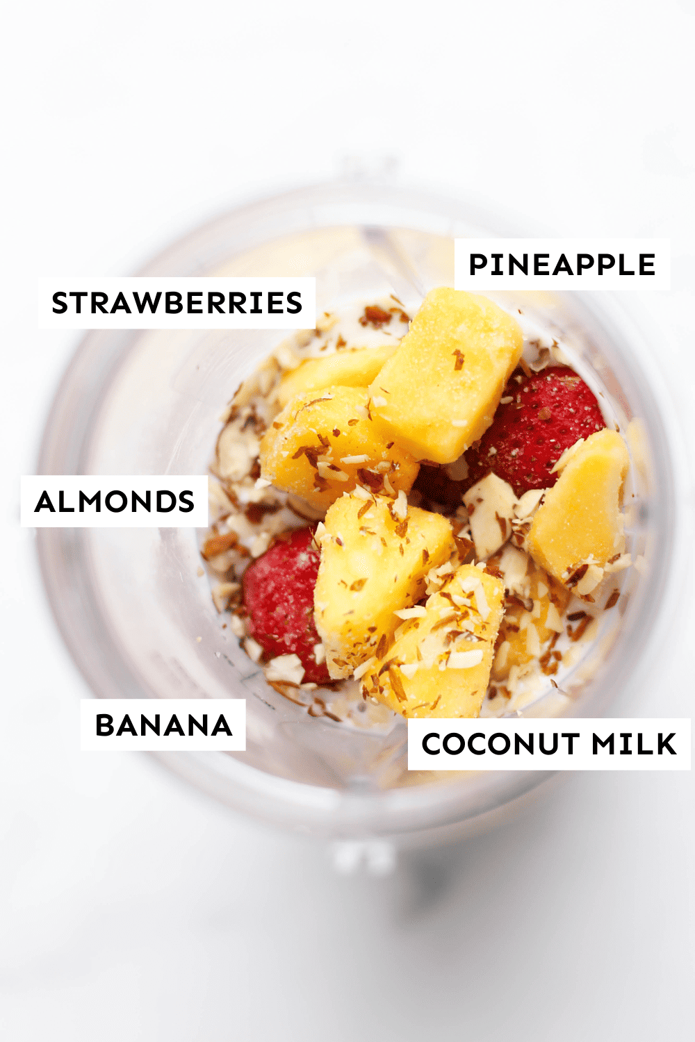 Labeled ingredients for a strawberry pina colada smoothie. 