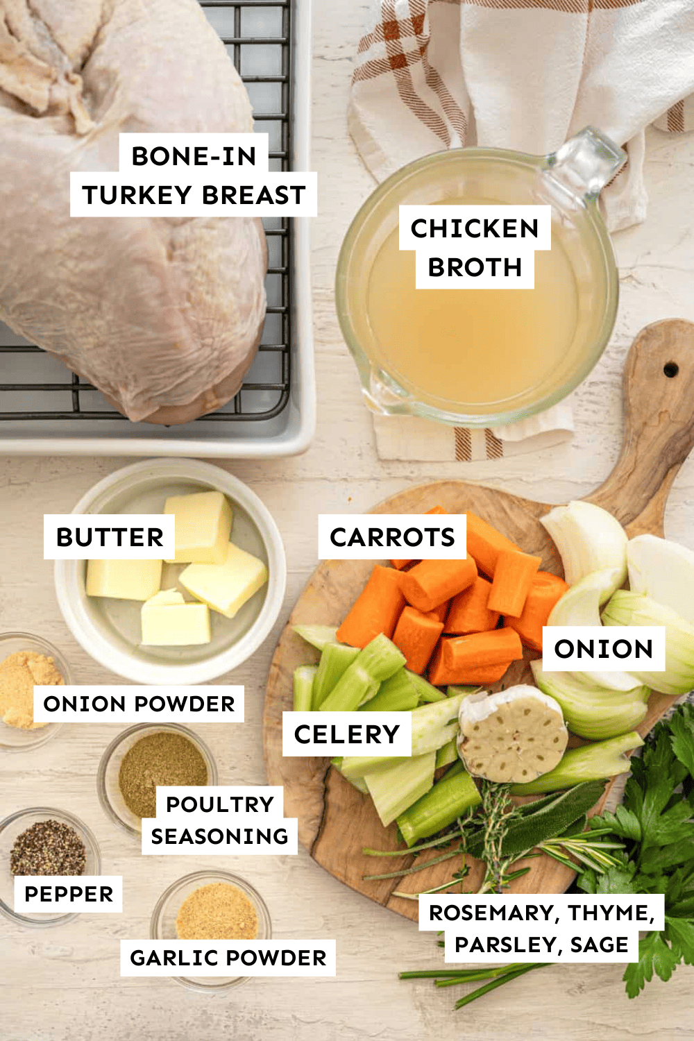 Labeled ingredients for roasting a turkey breast measured out onto a counter with some in bowls, and some on a wooden cutting board.