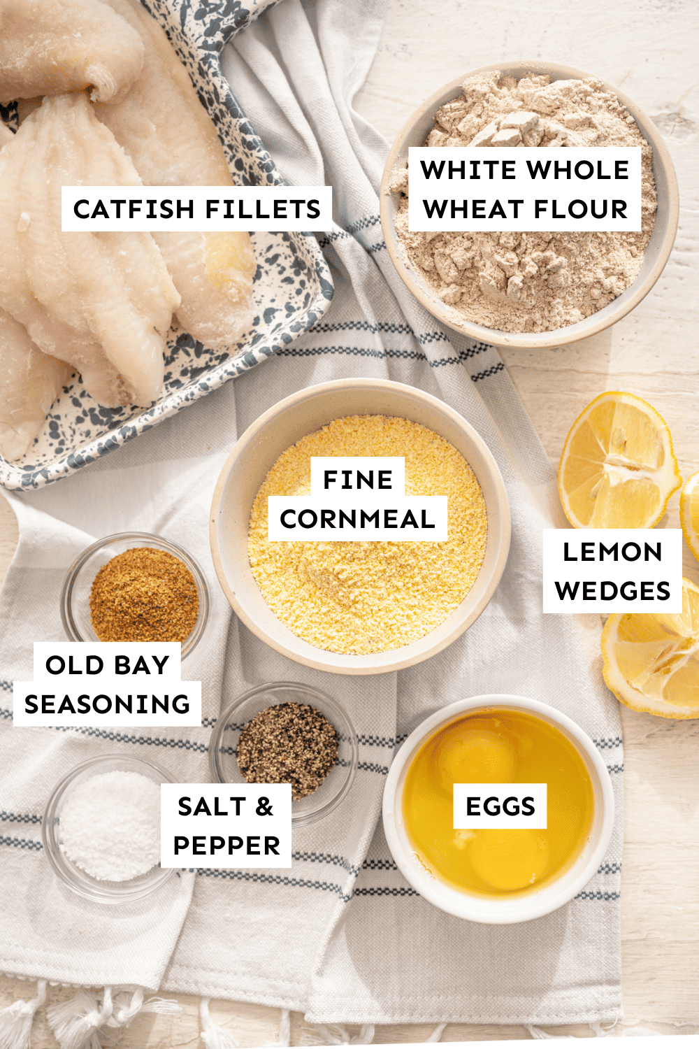 Fried catfish ingredients measured in bowls and labeled.
