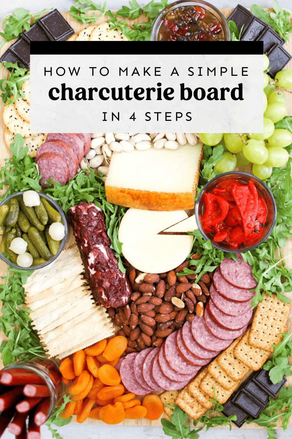 Overhead shot of a charcuterie board filled with meats, cheeses, veggies, and more.