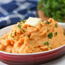 Healthy mashed potatoes with parsley and butter on top.