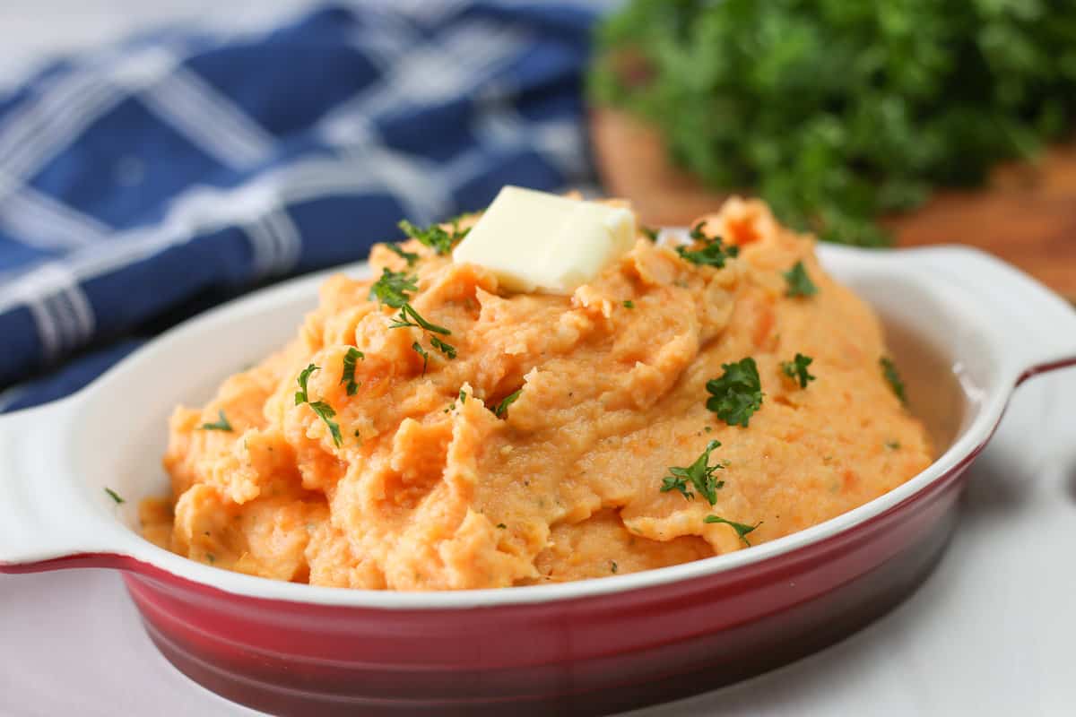 Healthy mashed potatoes with parsley and butter on top.