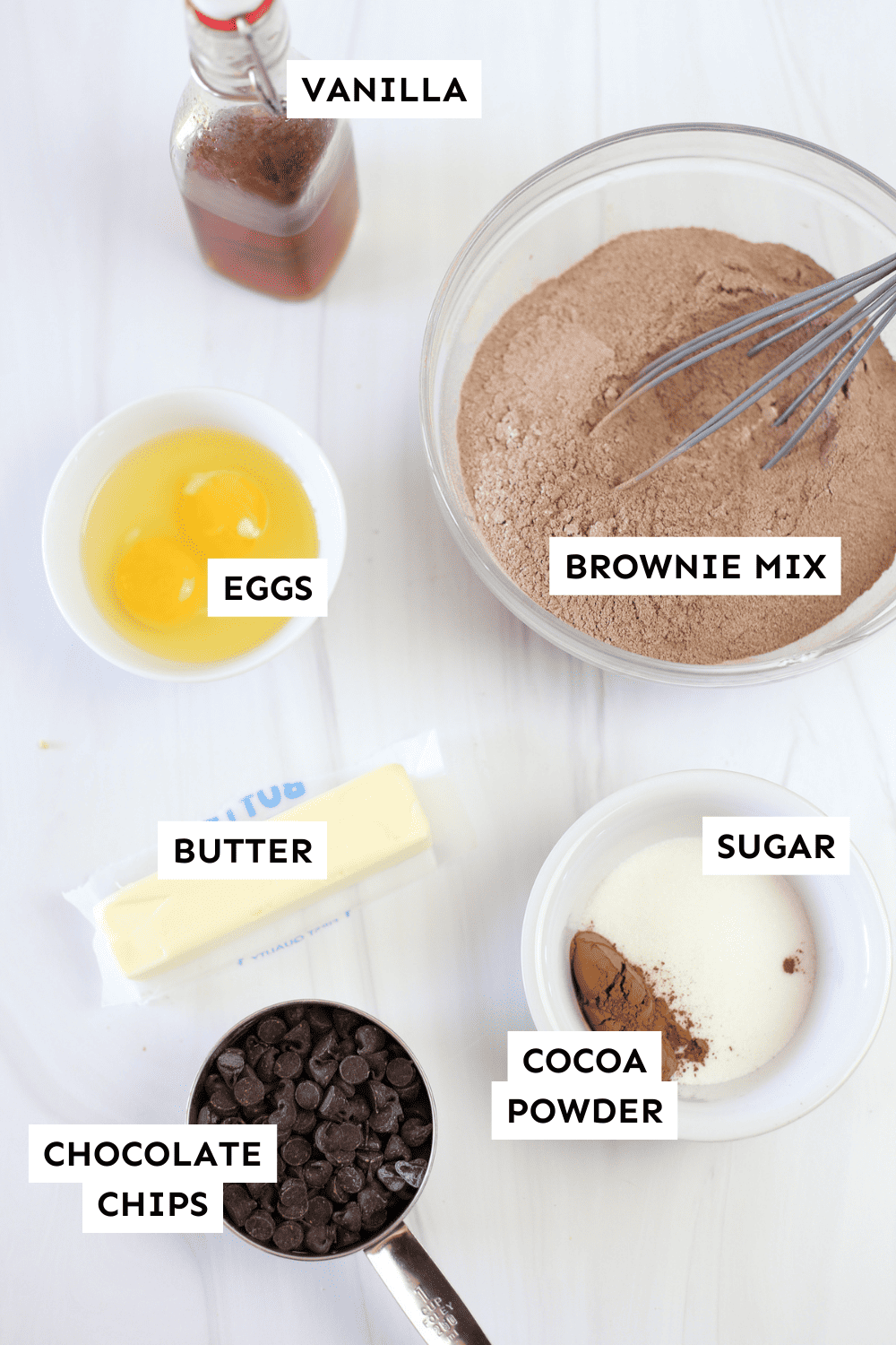 Brownie mix cookie ingredients measured in bowls and labeled.