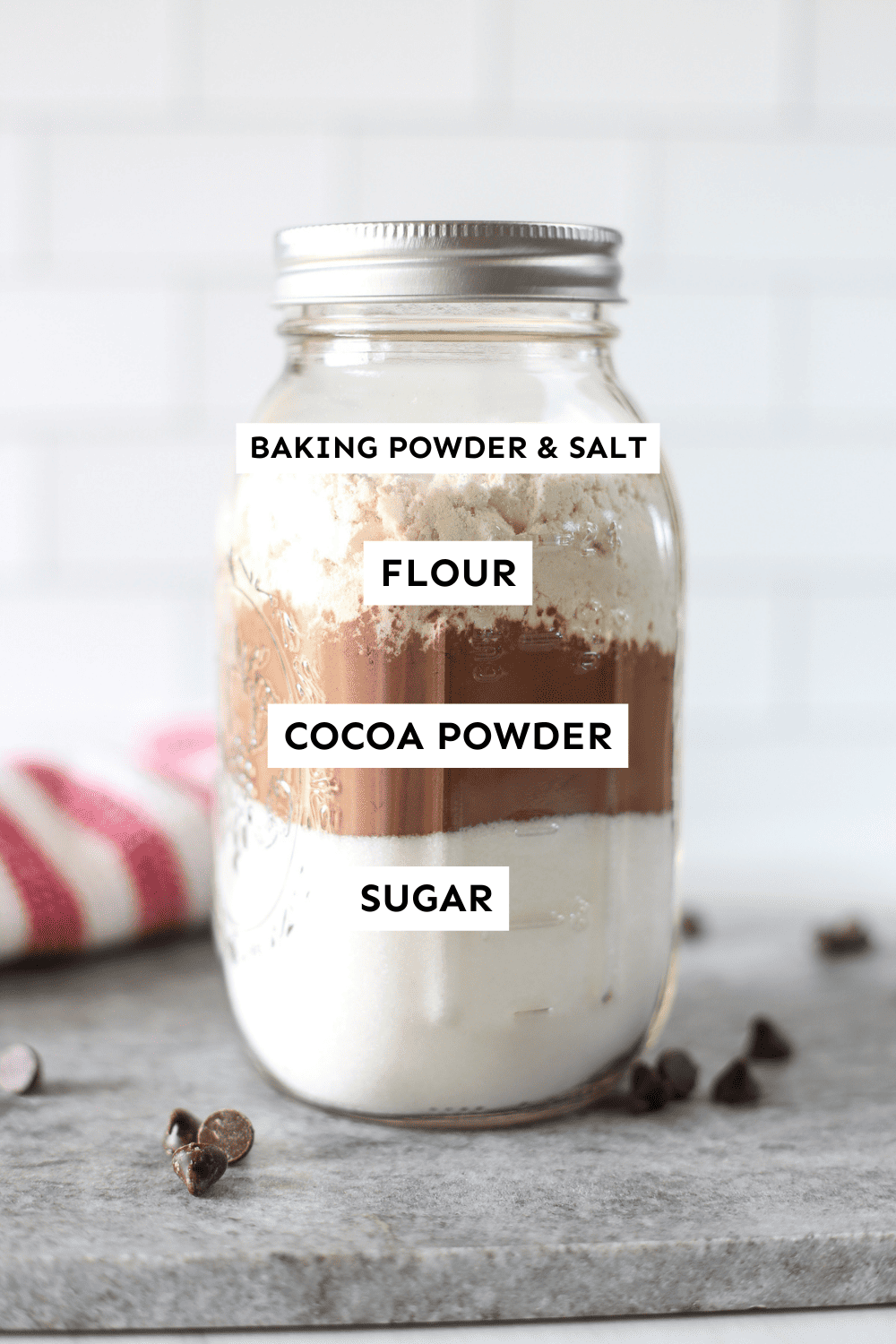 Brownie mix in a jar with labeled ingredients. 