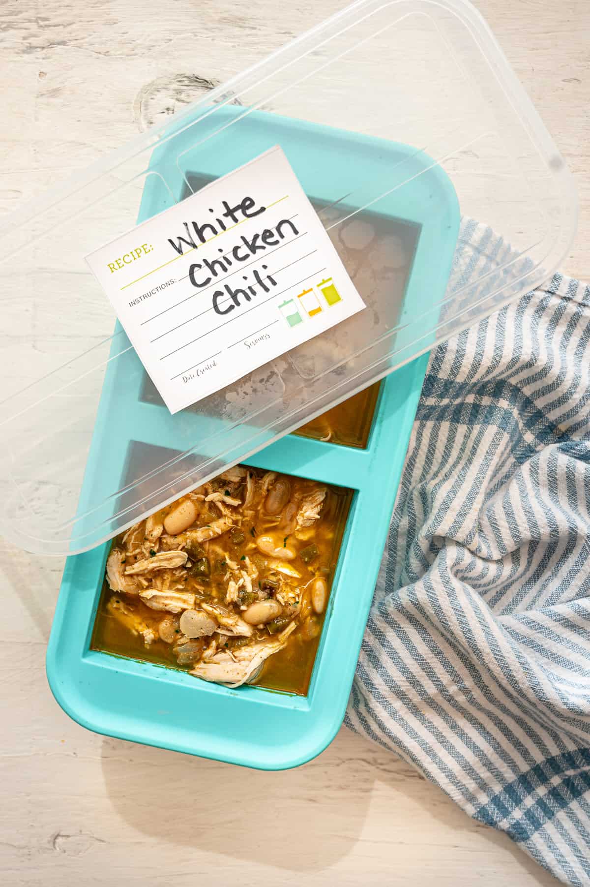 White chicken chili in a Souper Cubes container with a label on top.