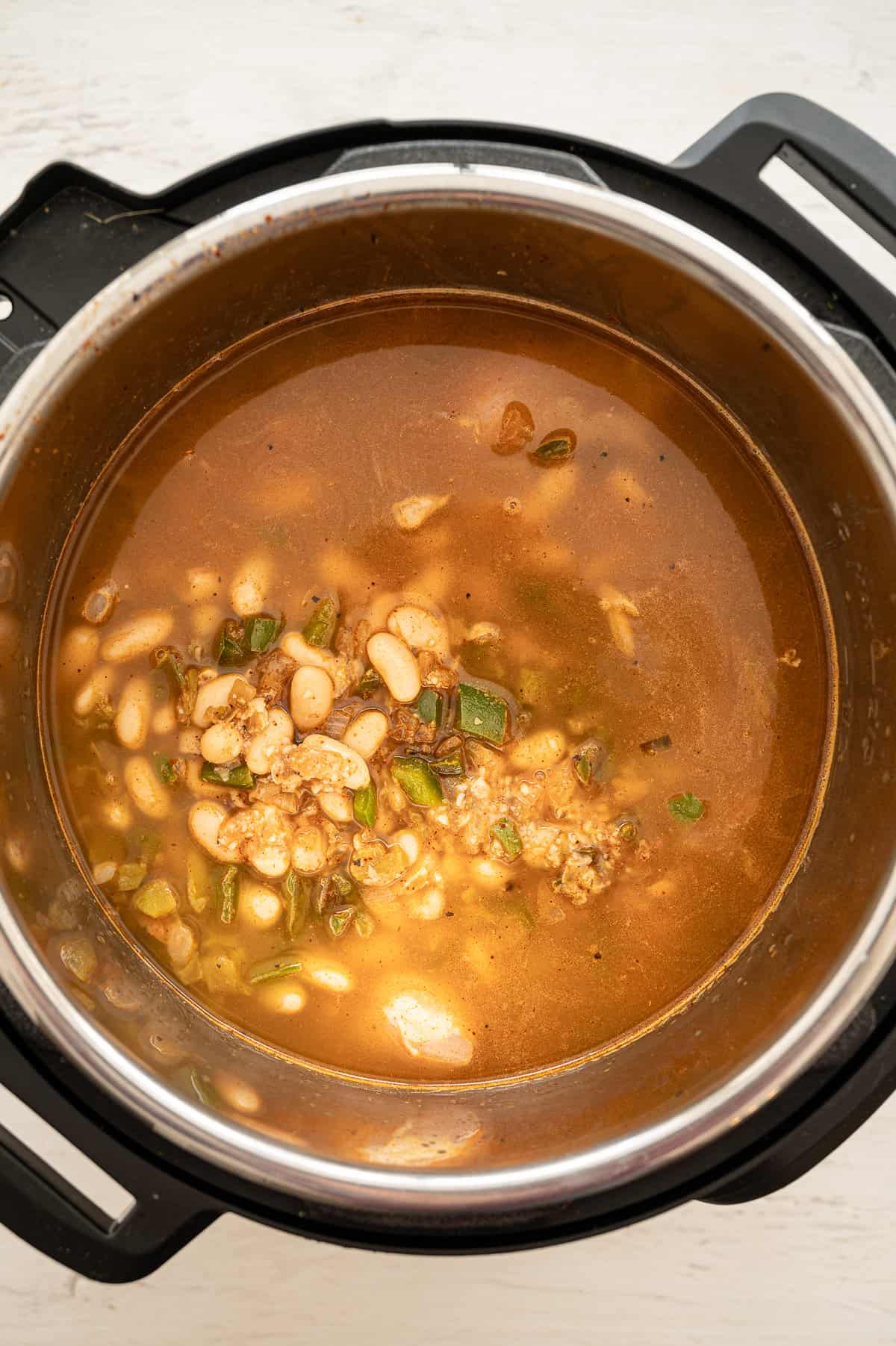 White chicken chili ingredients in an instant pot.