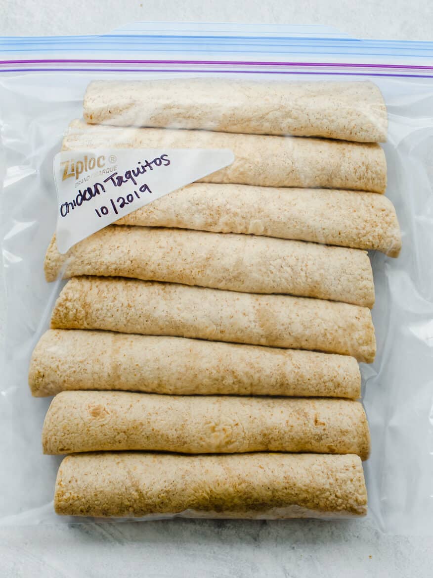 Chicken Taquitos rolled up and in a freezer bag for a freezer meal.